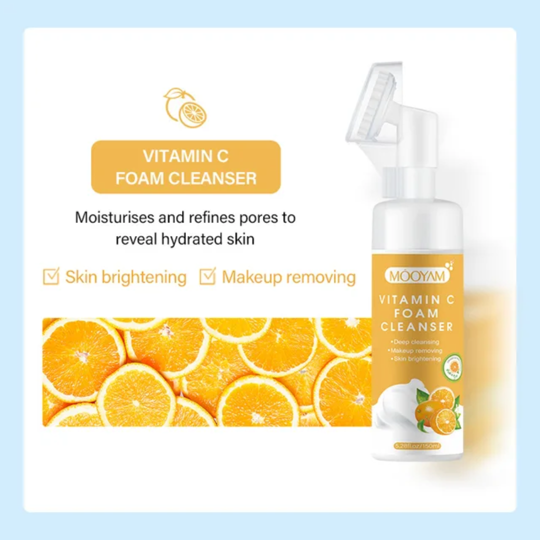 Vitamin C foam cleanser packaging with orange slices on a light blue background