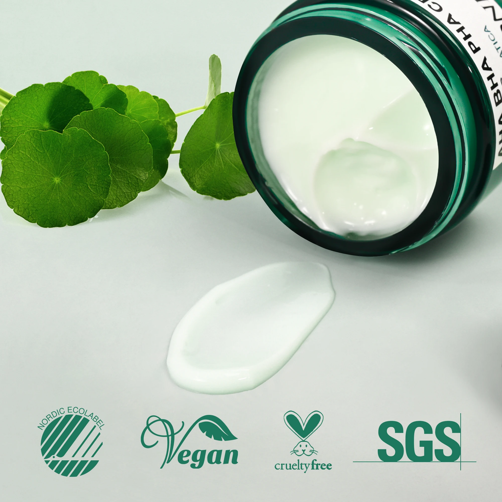 An open jar of white cream cosmetic product lies on its side with a smear of the cream placed in front. Green circular leaves decorate the left side, and certification logos including Nordics Ecolab, Vegan, Cruelty Free, and SGS appear along the bottom.