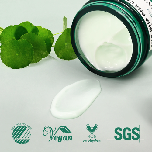 An open jar of white cream cosmetic product lies on its side with a smear of the cream placed in front. Green circular leaves decorate the left side, and certification logos including Nordics Ecolab, Vegan, Cruelty Free, and SGS appear along the bottom.