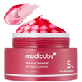 Red jar of Medicube TXA Niacinamide Capsule Cream with pink cream and capsules on a white background