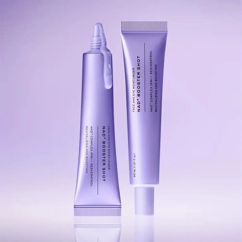 Two lavender cosmetic tubes on a soft lilac gradient background. One tube has a pointed applicator tip with product dripping out, and the other tube stands upright with text reading 'FACE AND CHEX BOOSTER AND BOOSTER SHOT' and '30 mL FL OZ'.