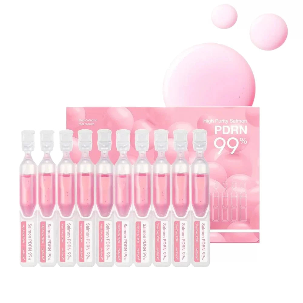 Set of pink ampoules with a pink packaging box on a white background
