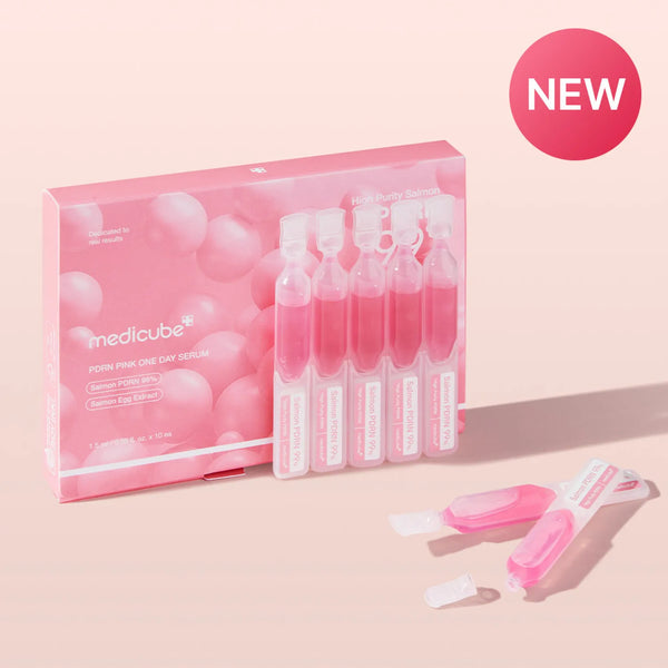Packaging of Medicube serum with ampoules on a pink background