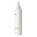 White bottle of 'milk shake' color care product on a white background