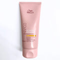 Wella Professionals Ivigo Blonde Recharge Warm color-enhancing conditioner in a pink squeeze tube, shown on a clean white background.