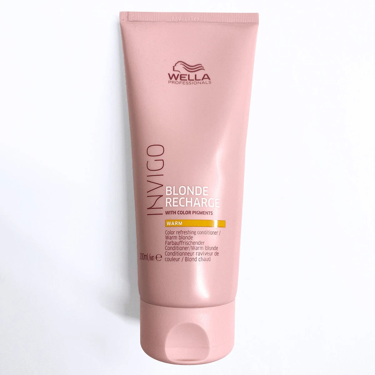 Wella Professionals Ivigo Blonde Recharge Warm color-enhancing conditioner in a pink squeeze tube, shown on a clean white background.